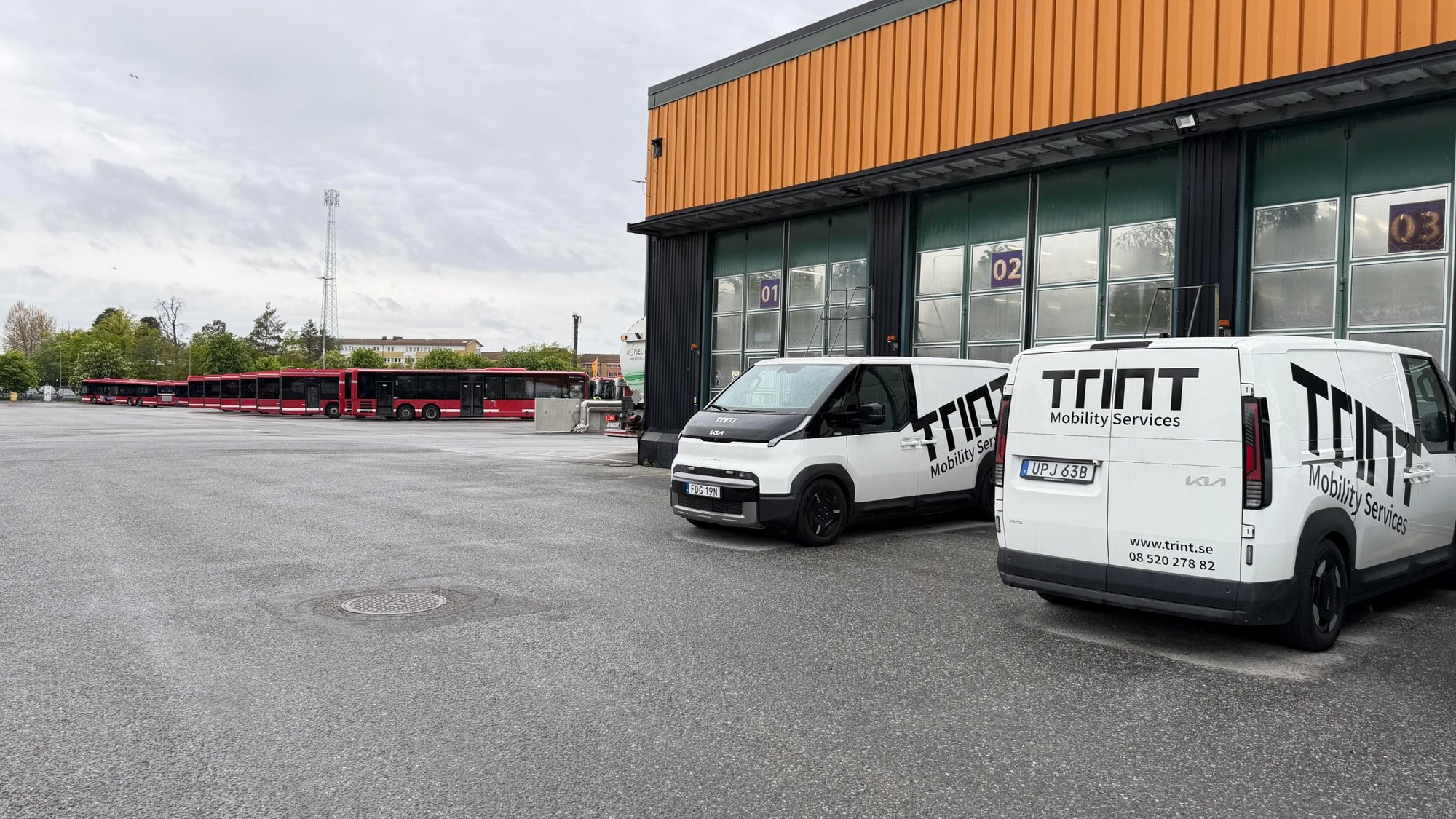Depot with TRINT's fleet of service buses and service vans